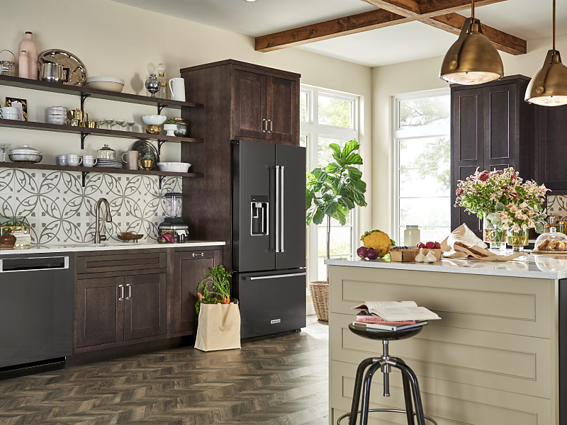 Black french door refrigerator in kitchen with coordinating colors
