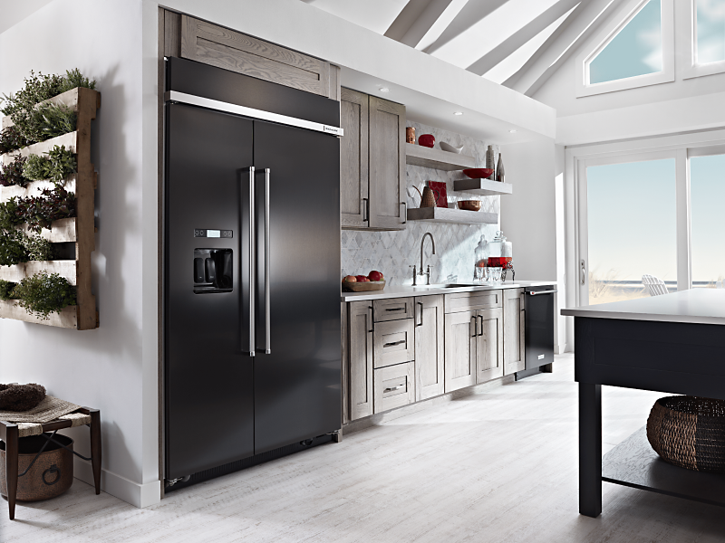 Black side-by-side refrigerator in small kitchen