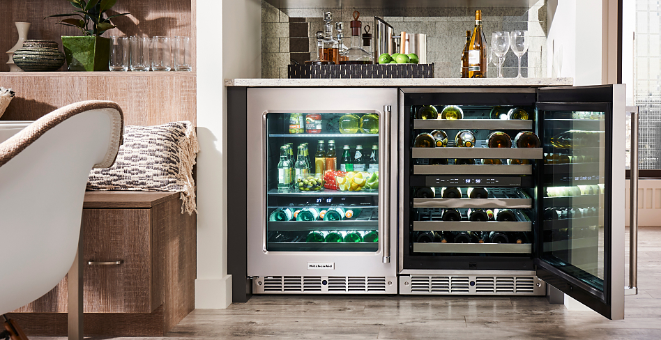 Side-by-side wine refrigerators, one opened and one closed