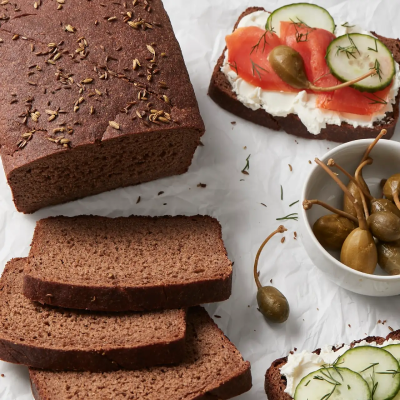 Sliced pumpernickel with cream cheese, lox and cucumbers
