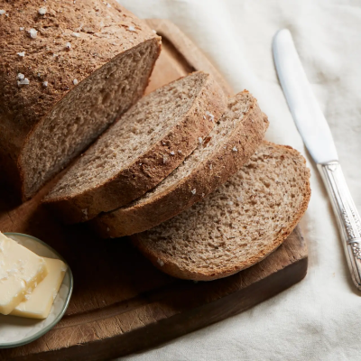 Sprouted bread next to a butter knife