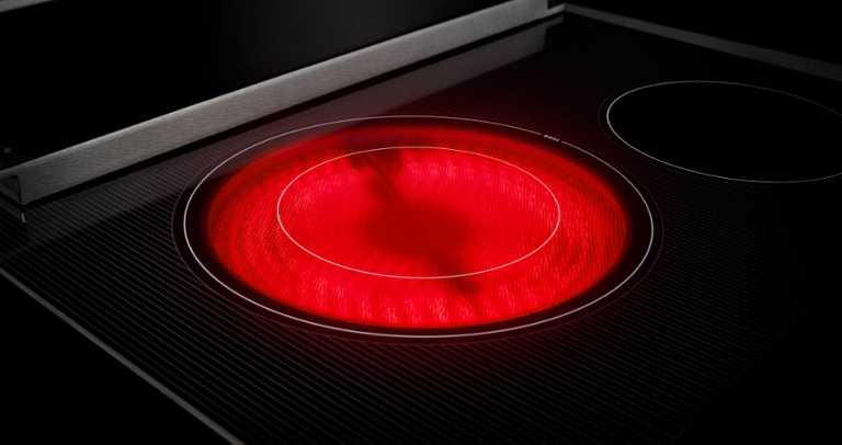 A glass cooktop burner that has fully heated