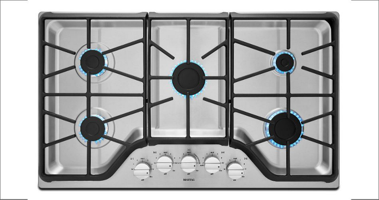 A gas range cooktop featuring five burners.
        
