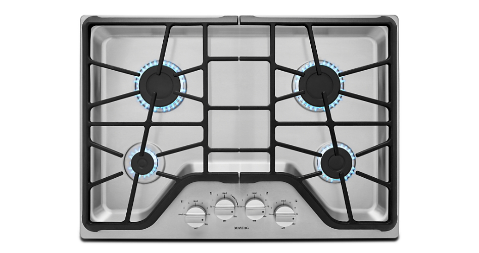 Photo of a gas cooktop with four burners