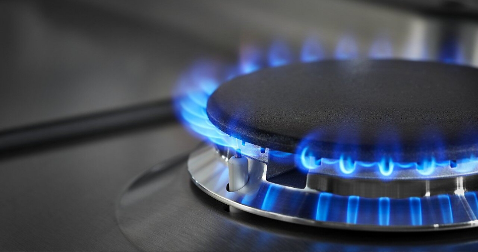 Photo of a gas cooktop with blue flame