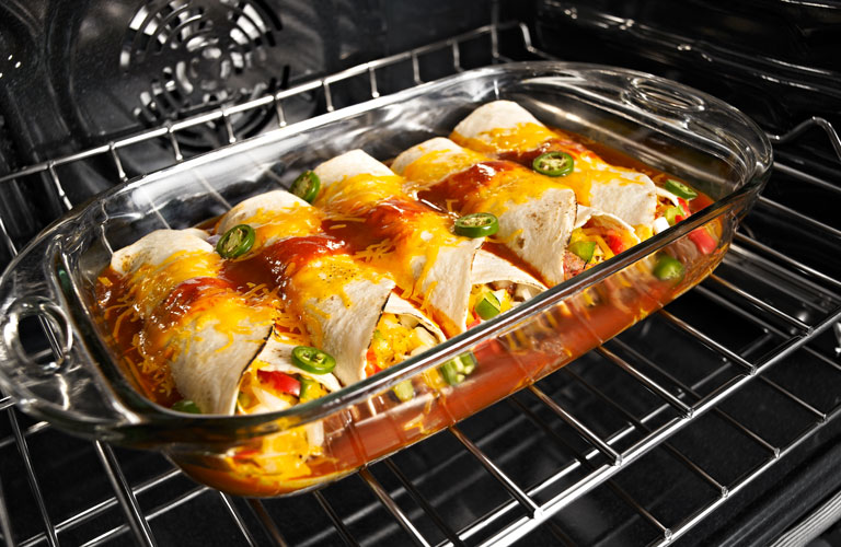 Burritos cooking in oven