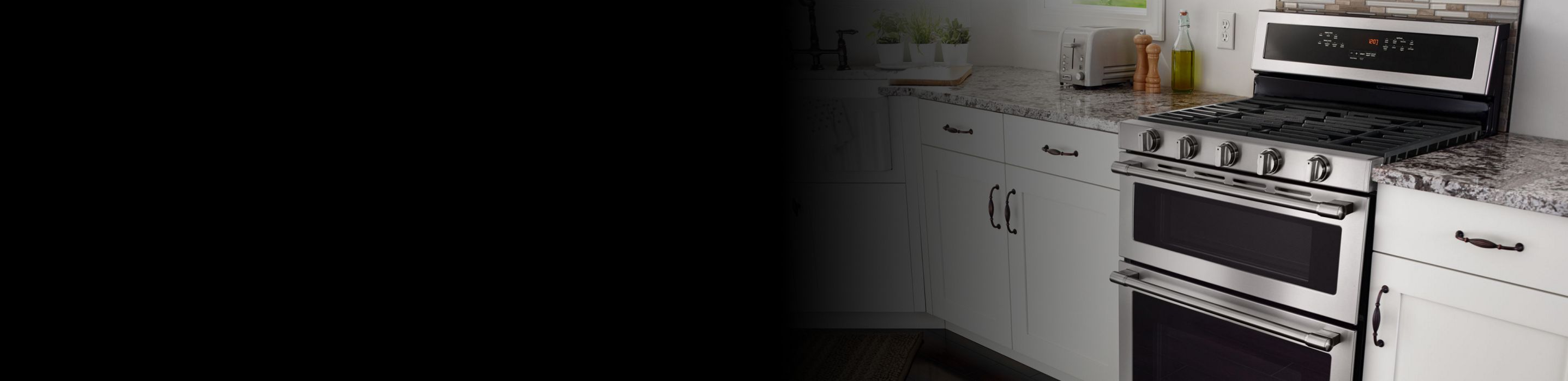 A slide-in Maytag® range between two counters.