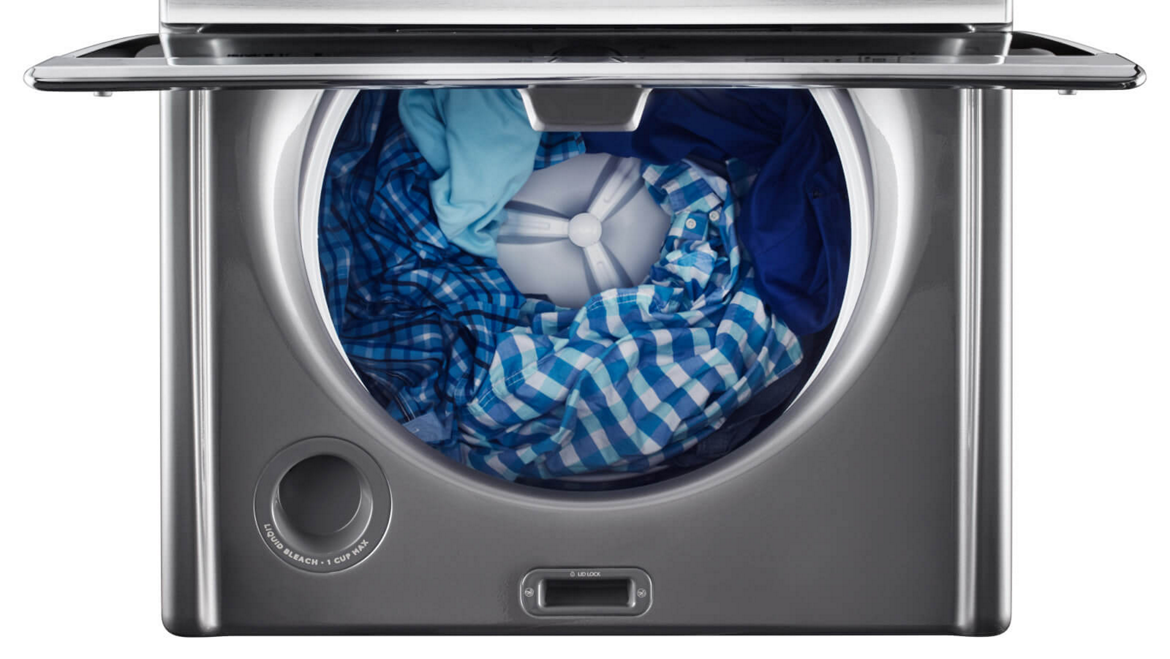 Maytag® top-load washer properly loaded with clothes.