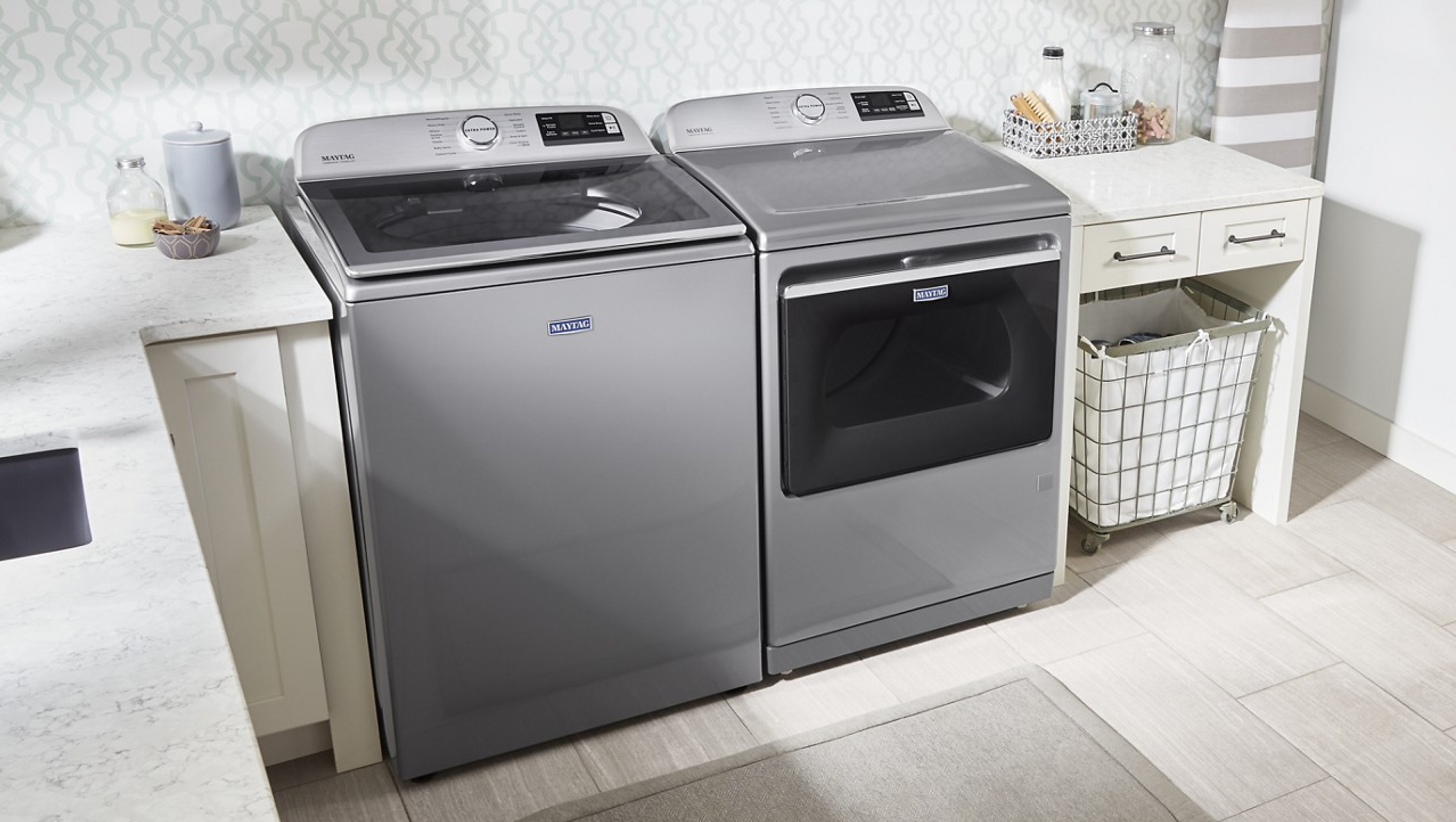 Maytag® top load washer and dryer in a laundry room