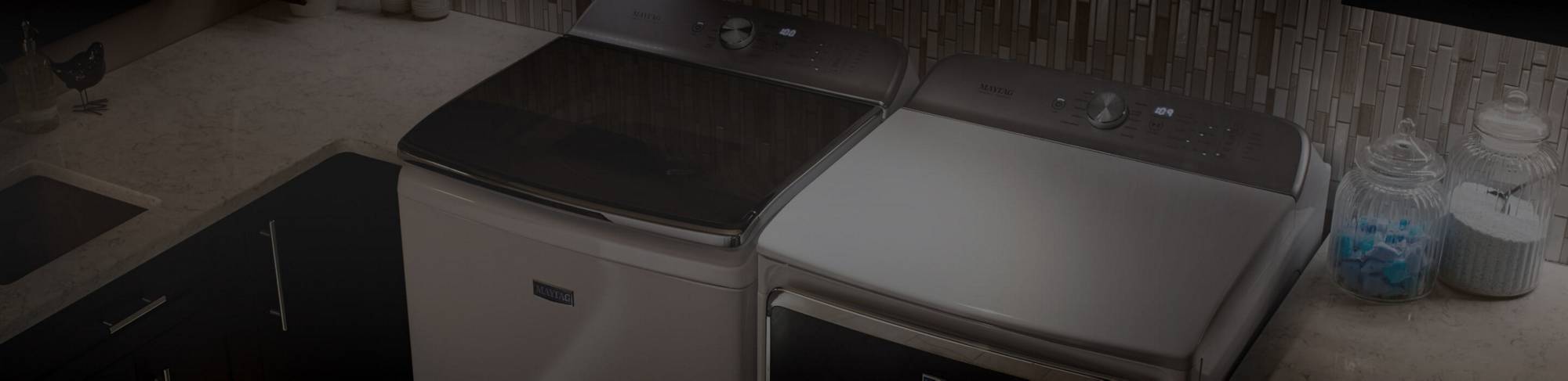 A sleek laundry room featuring a Maytag® washer and dryer pair.