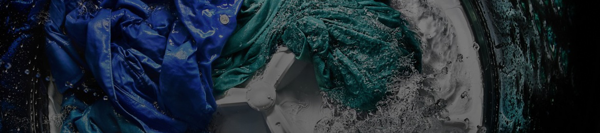 A Maytag® washer rinsing clothes.