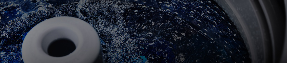 Maytag® top-load washer filled with hot water.