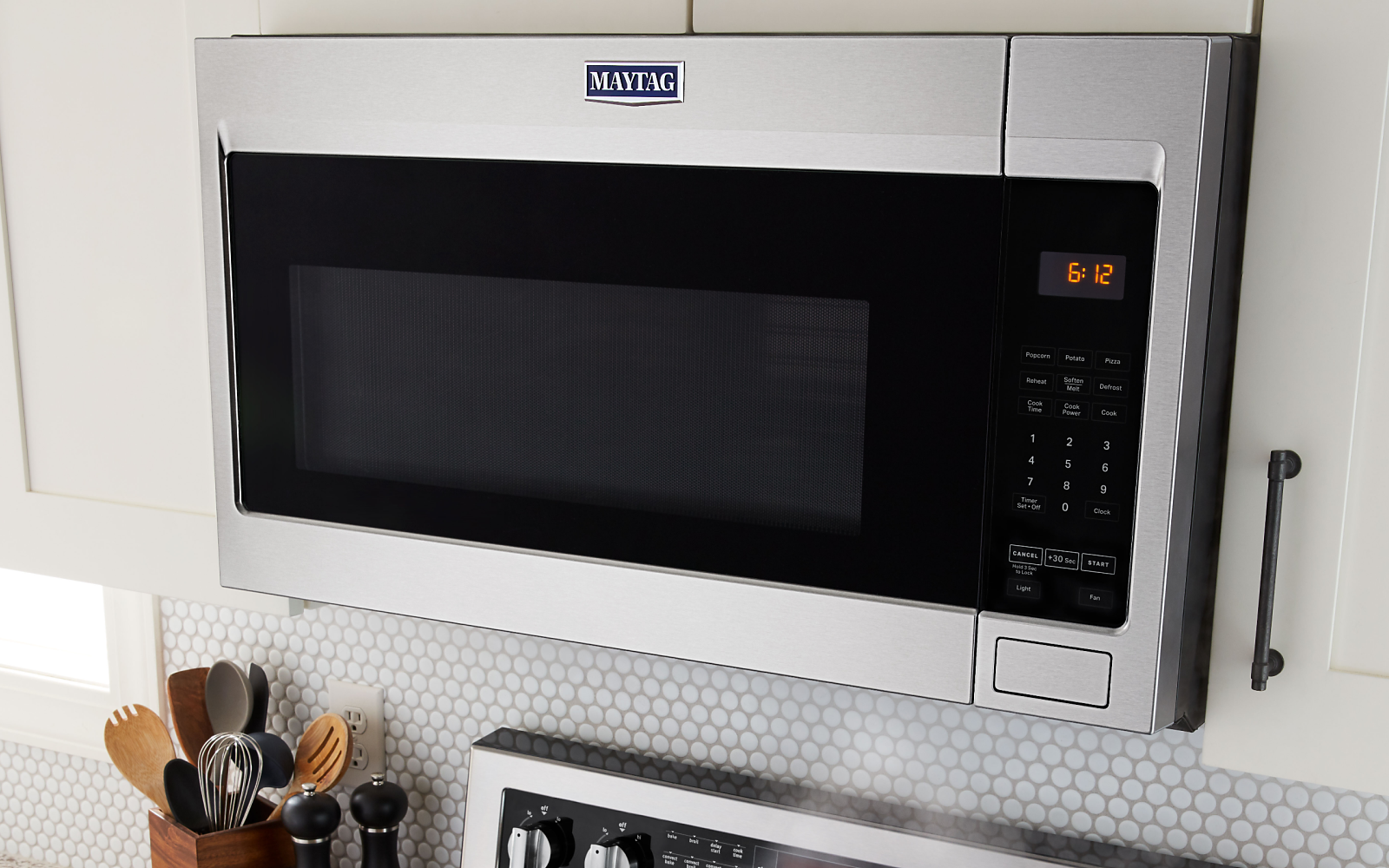 Maytag® stainless steel microwave between white cabinets Maytag® stainless steel microwave between white cabinets