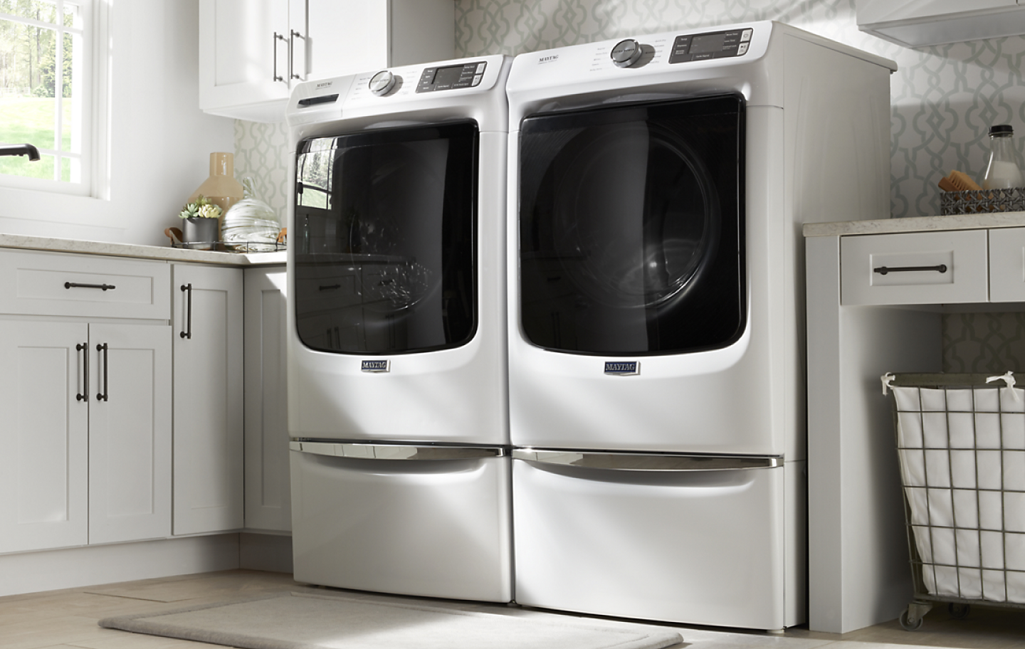 White Maytag® front-load washer and dryer pair.