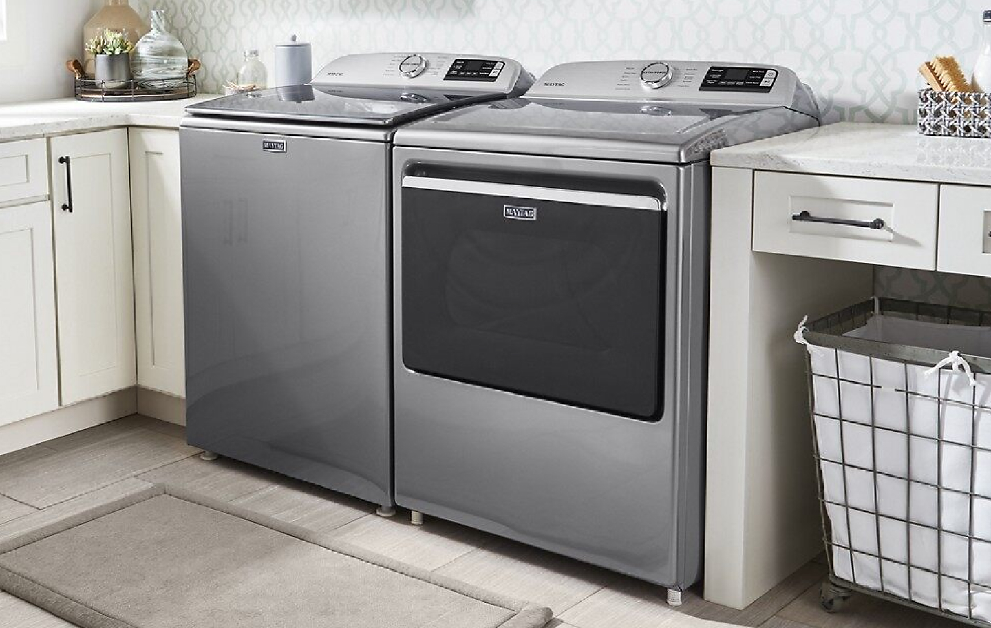 Gray Maytag® top-load washer and dryer pair.