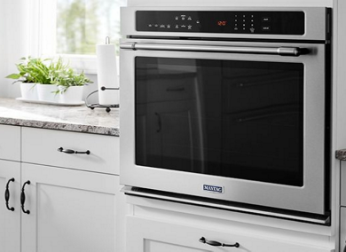Water boiling on top of a Maytag oven