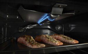Gas stove with clearance broiler in oven