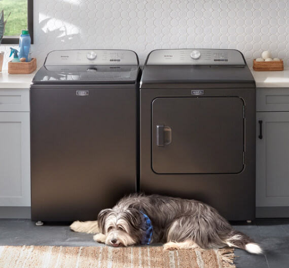 A closeup of a Maytag® dryer in Volcano Black.