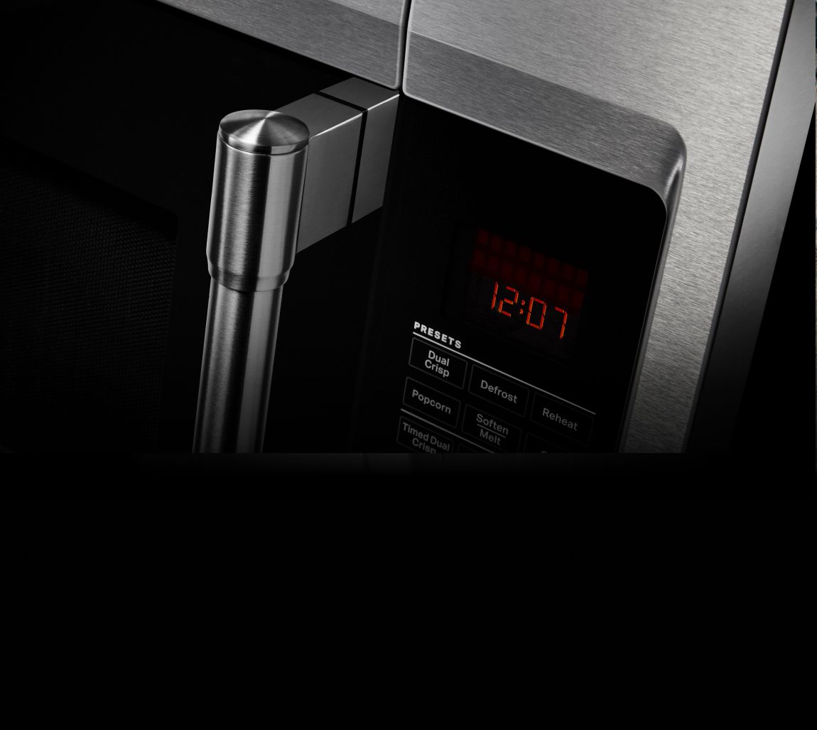 Closeup of a Maytag® microwave door handle.