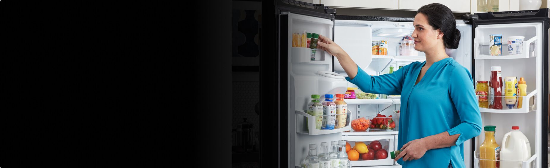 An open Maytag® refrigerator.