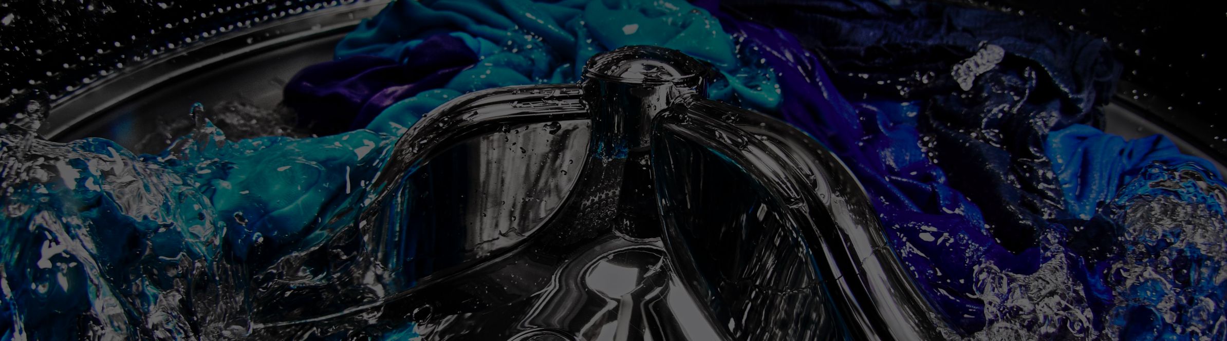 Up close image of blue clothing in a Maytag® washer.