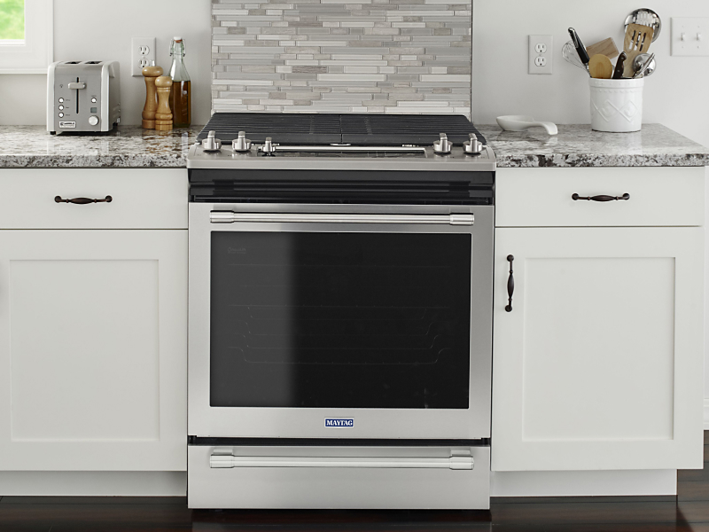 Maytag® gas range set in cabinetry
