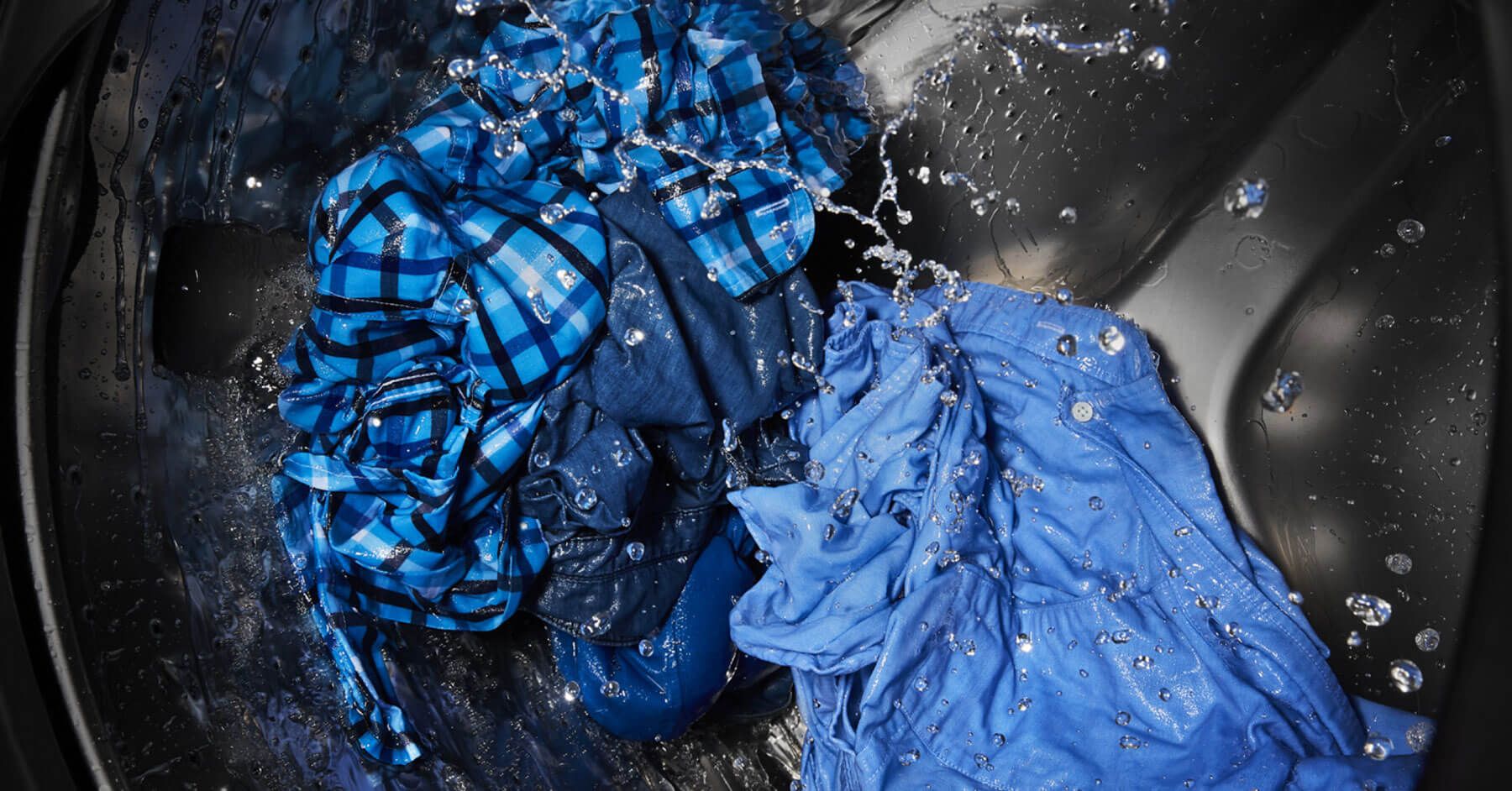 Clothes tumbling in a washing machine.