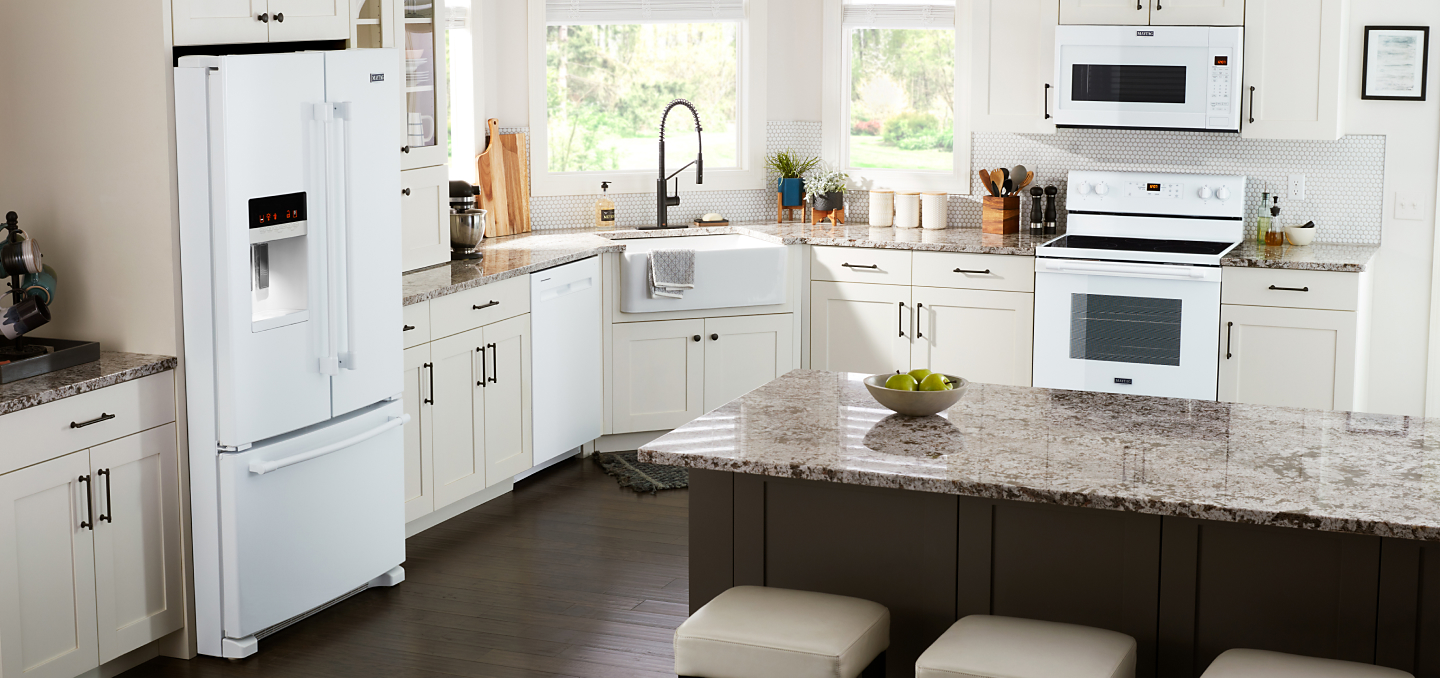 White Maytag® appliances in a white kitchen