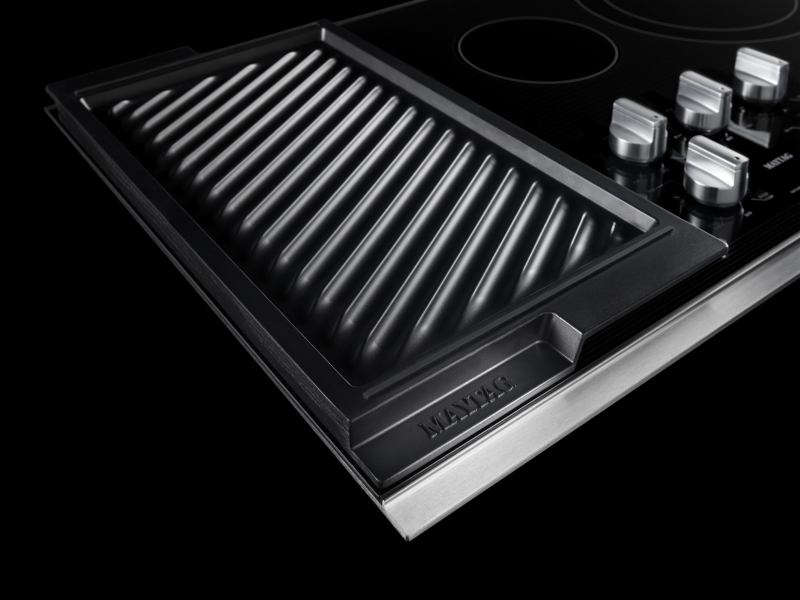 A Maytag® electric cooktop with reversible grill and griddle