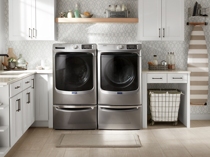 Maytag® washer and dryer installed on laundry pedestals