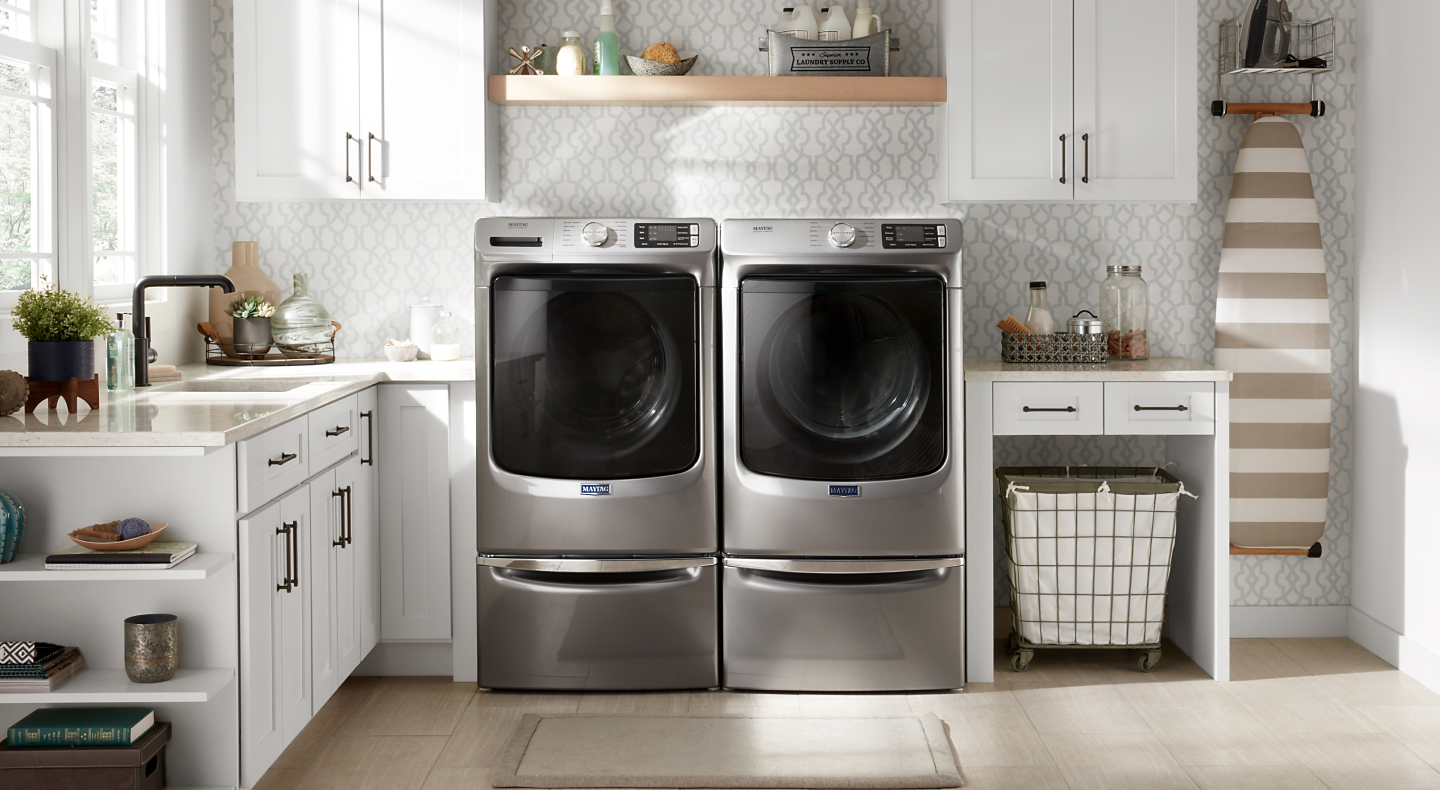 Maytag® washer and dryer installed on laundry pedestals