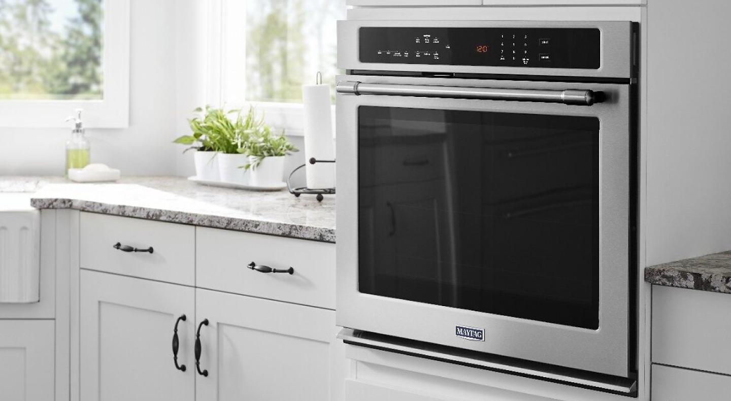 Maytag® wall oven in a bright white kitchen