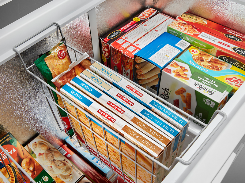 Frozen meals and appetizers in a Maytag® freezer.
