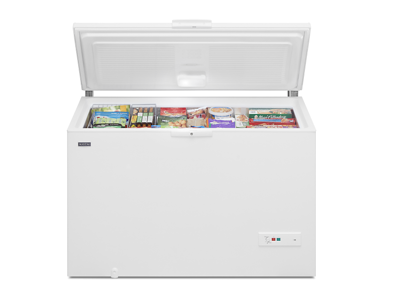 An opened white Maytag® chest freezer.