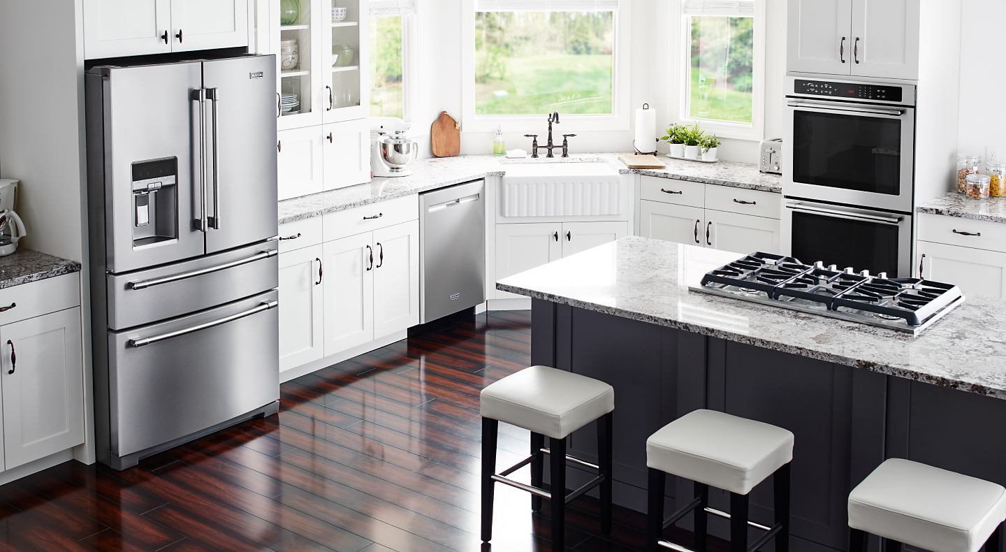 Stainless steel Maytag® appliances in a modern kitchen