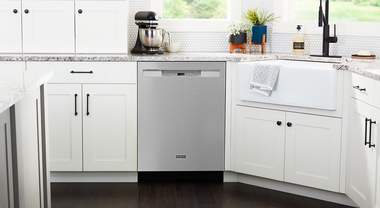 Maytag® stainless steel dishwasher in white cabinetry