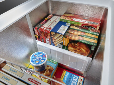 Frozen food inside of a chest freezer
