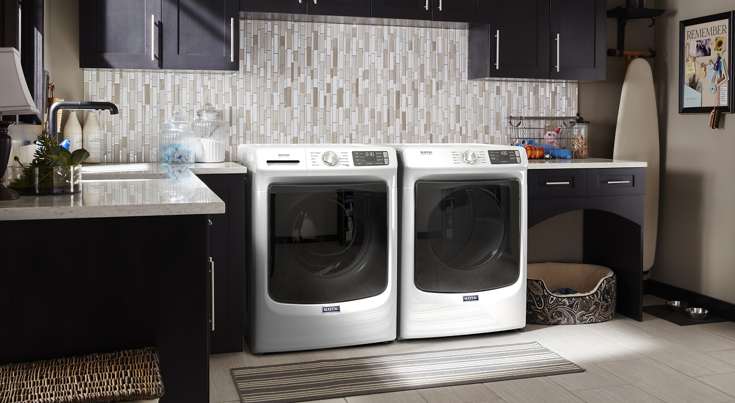 A Maytag® Front Load Washer and Dryer in a contemporary laundry room