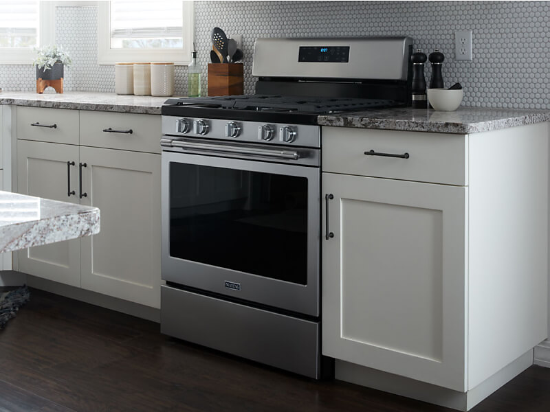 Maytag® range set in white cabinetry