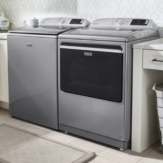 White washer and dryer pair in laundry room