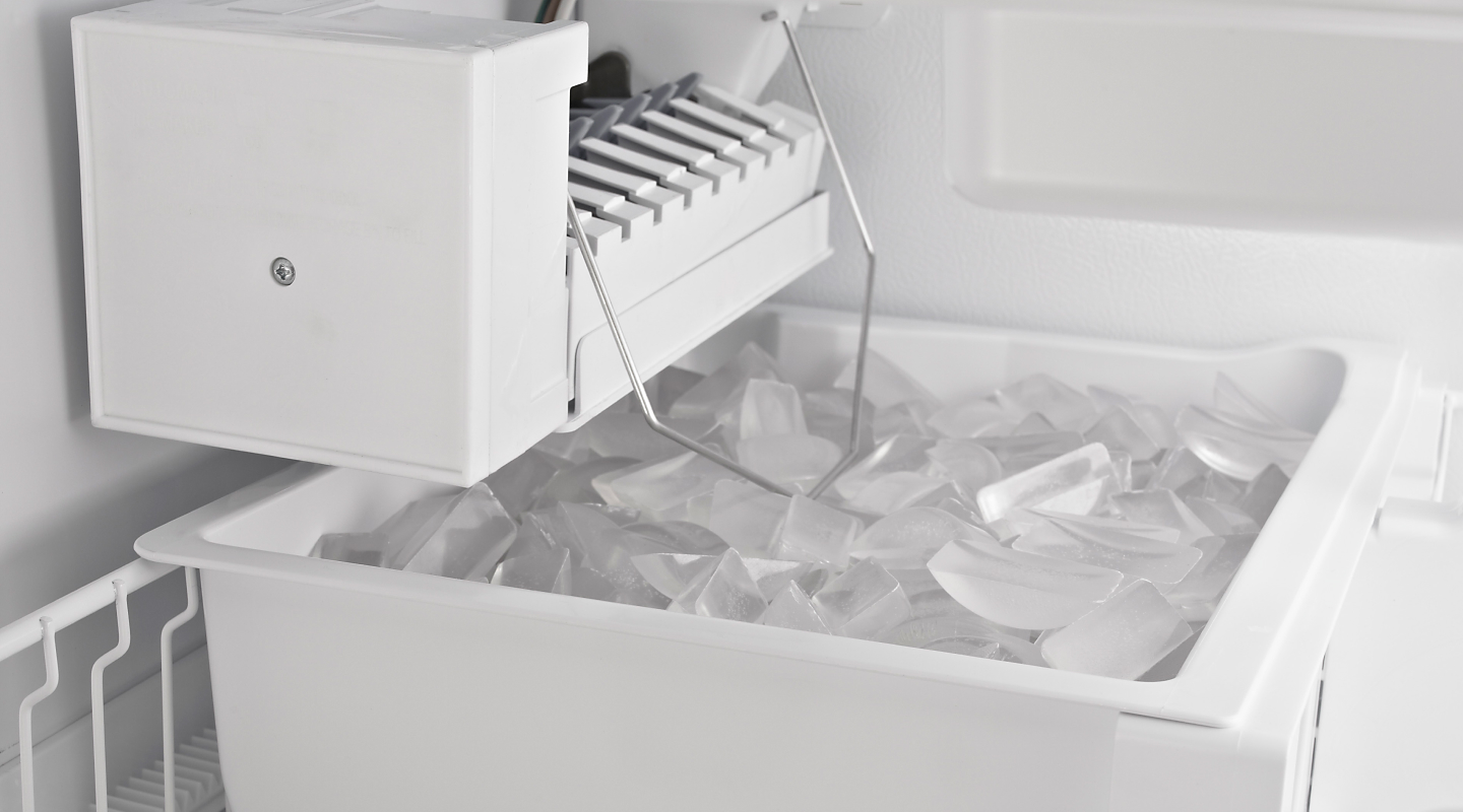 Refrigerator ice bin full of ice