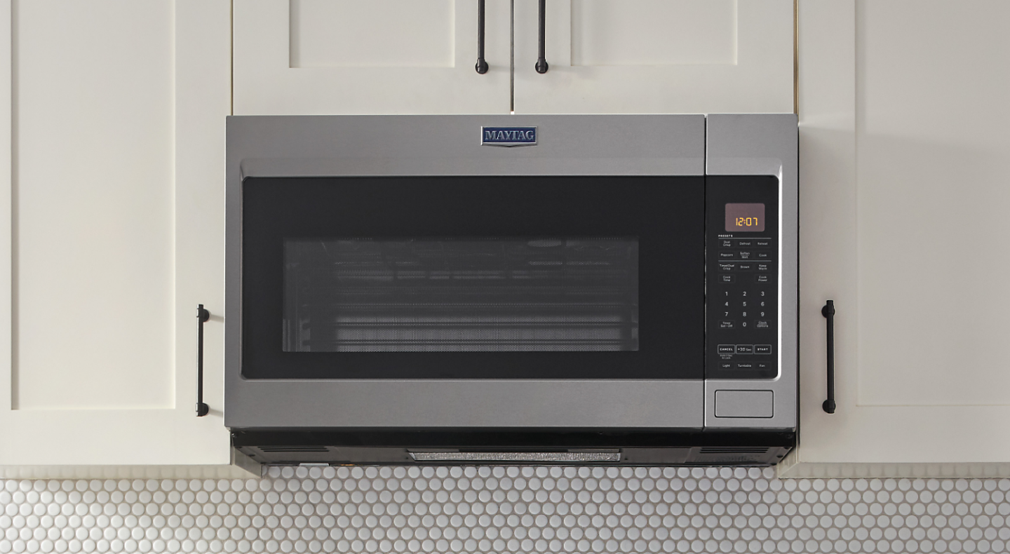 A closeup of a Maytag® over-the-range microwave.