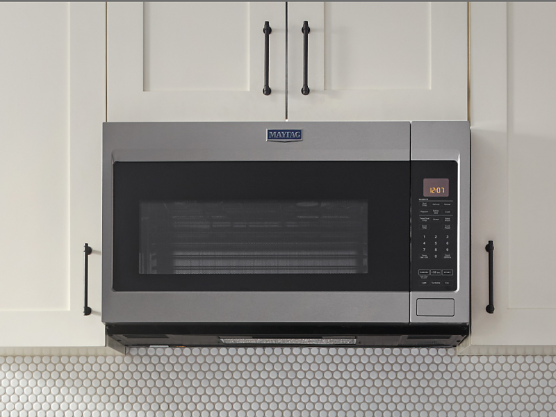 A closeup of a Maytag® over-the-range microwave.