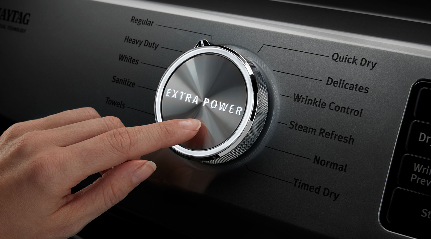 A person selecting the Extra Power option on a Maytag® dryer