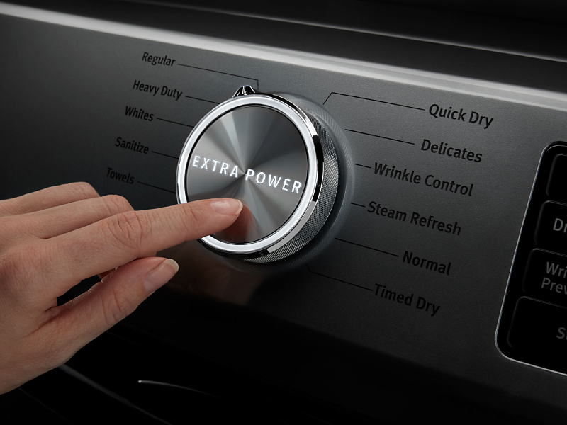 A person selecting the Extra Power option on a Maytag® dryer