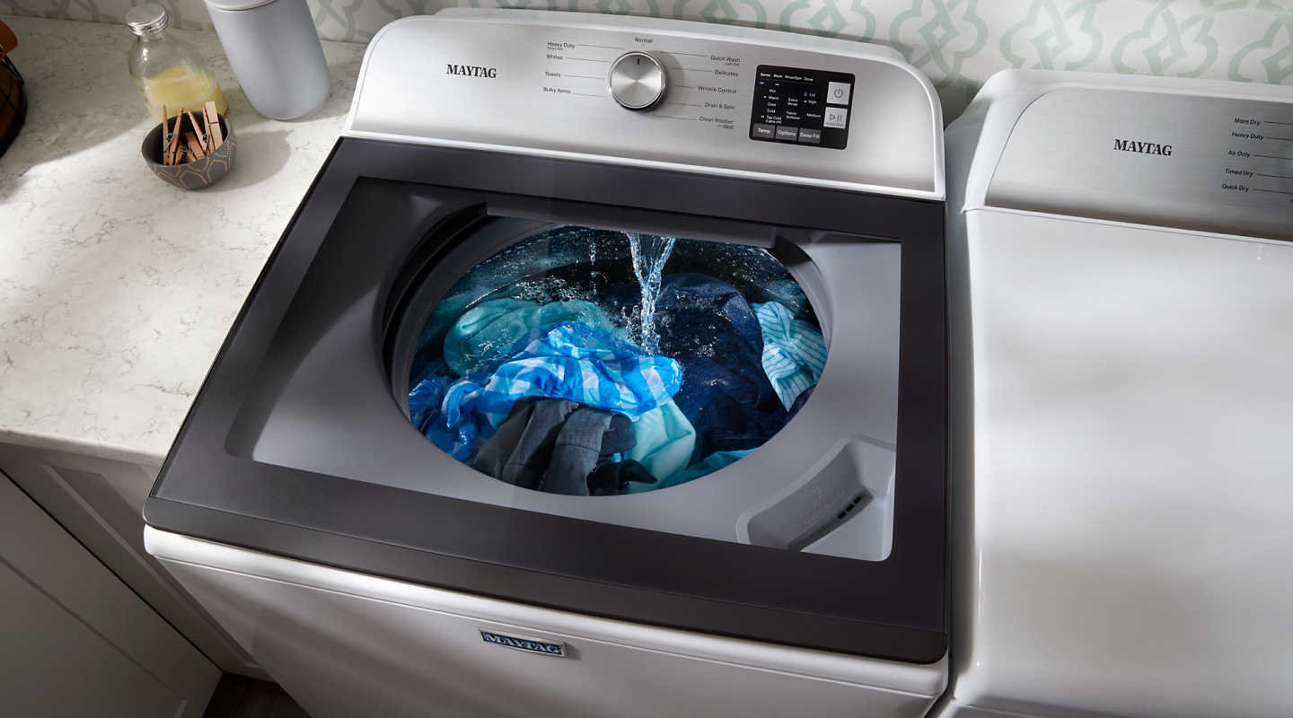 Maytag® top loading washing machine washing clothes