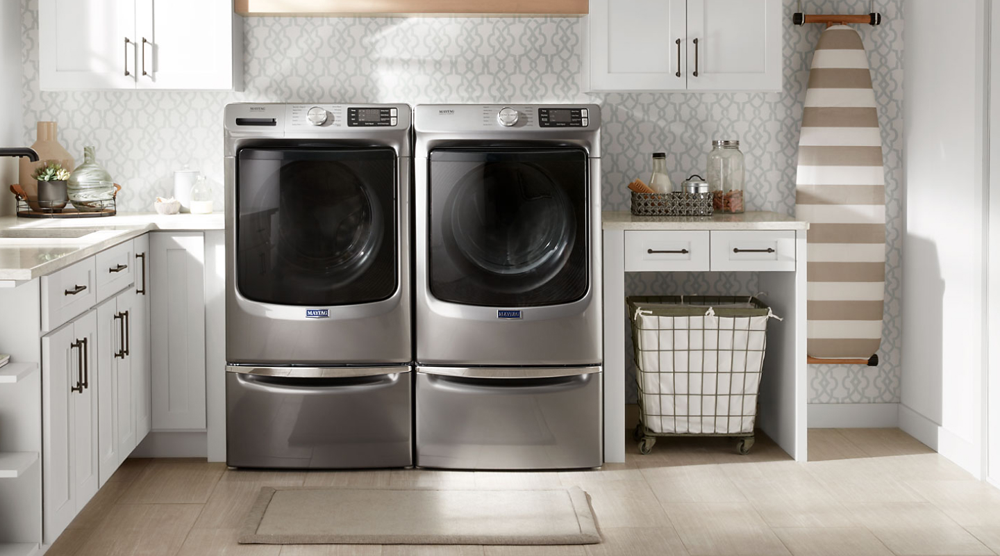 Maytag® front loading washer and dryer in a laundry room Maytag® front loading washer and dryer in a laundry room