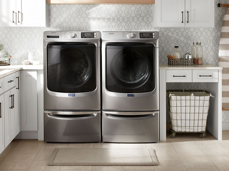 Maytag® front loading washer and dryer in a laundry room