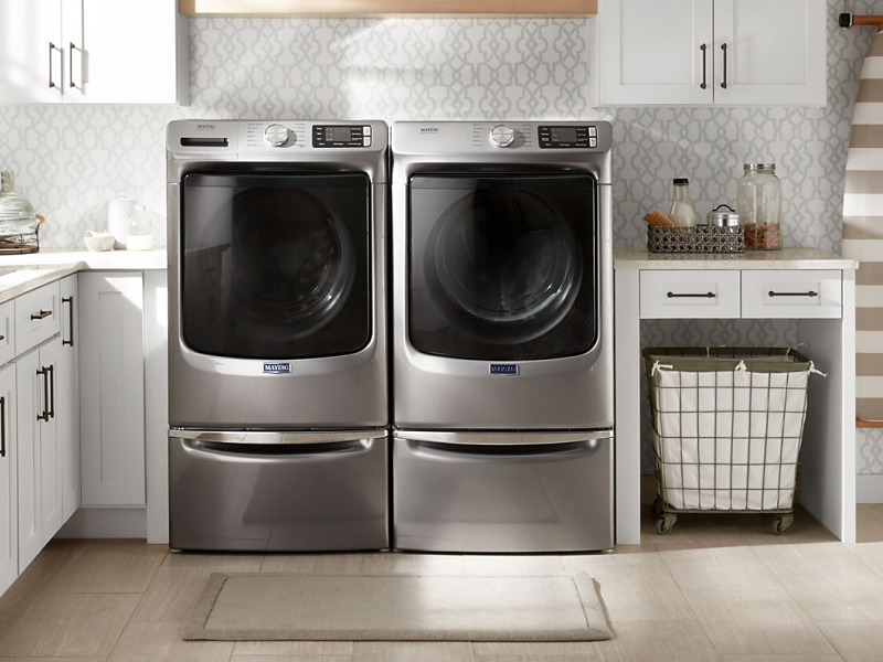 Maytag® front loading washer and dryer in a laundry room Maytag® front loading washer and dryer in a laundry room