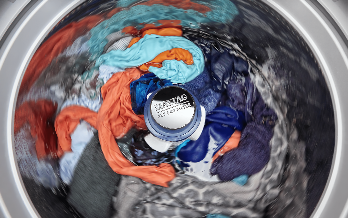 Clothes spinning in a Maytag® washer with a Pet Pro Filter